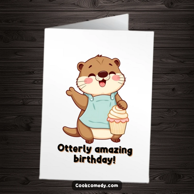 Funny Free Printable Birthday Card: An otter in an apron happily decorates a small cupcake, spreading birthday cheer.